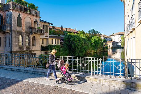Pushing a stroller on the streets of Sacile
