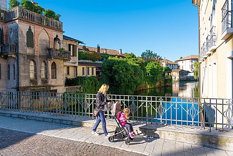Pushing a stroller on the streets of Sacile