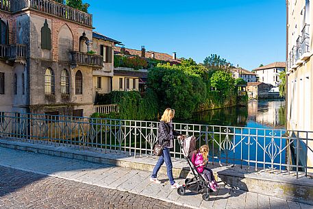 Pushing a stroller on the streets of Sacile