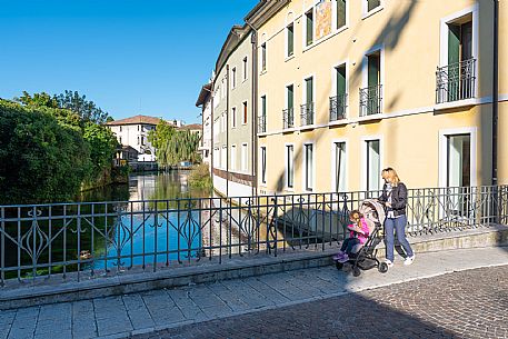 Pushing a stroller on the streets of Sacile