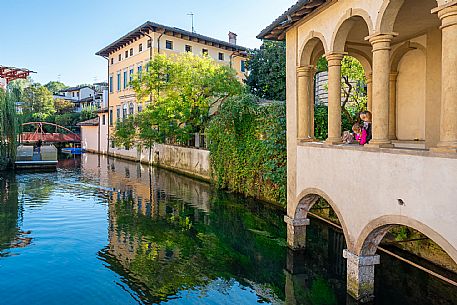 Pushing a stroller on the streets of Sacile