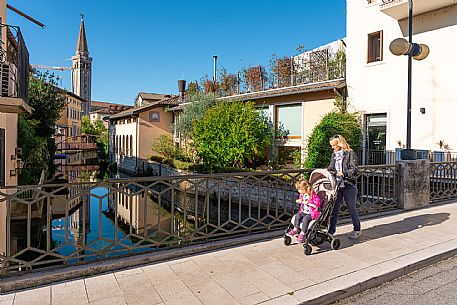 Pushing a stroller on the streets of Sacile