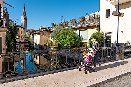 Pushing a stroller on the streets of Sacile