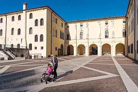 Pushing a stroller on the streets of Sacile
