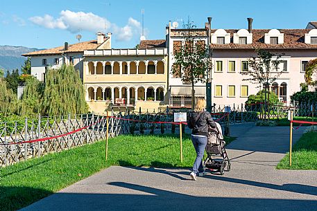 Pushing a stroller on the streets of Sacile