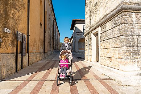 Pushing a stroller on the streets of Sacile