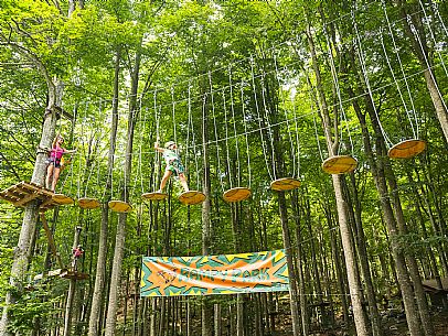 Located in a wonderful beech forest near the tourist resort of Piancavallo, a few hundred meters from the services of the town centre, the Rampy Park offers fun, excitement and the possibility of spending a day outdoors in a safe and stimulating environment. Rampy Park is spread over 50 platforms in 5 different routes differentiated based on difficulty. Everyone from children over 5 years of age and 1 meter tall to adults without age limits can try it. Located in a wonderful beech forest near the tourist resort of Piancavallo, a few hundred meters from the services of the town centre, the Rampy Park offers fun, excitement and the possibility of spending a day outdoors in a safe and stimulating environment. Rampy Park is spread over 50 platforms in 5 different routes differentiated based on difficulty. Everyone from children over 5 years of age and 1 meter tall to adults without age limits can try it.