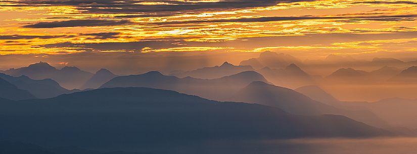 Sunrise on the Friulian plain from Piancavallo (Castaldia). On the background the mountain range of Carnia and Julian Alps 