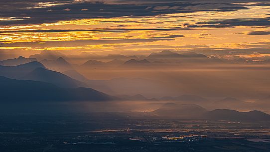 Sunrise on the Friulian plain from Piancavallo (Castaldia). On the background the mountain range of Carnia and Julian Alps 