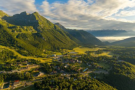 The town of Piancavallo seen from above. In the background the Cima del Cavallo and on the right the Friulian Dolomites and Valcellina