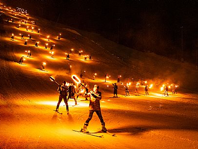 Monte Santo di Lussari.
The Di Prampero slope in Camporosso welcomed 2024 with the 51st of the longest torchlight procession in the entire Alpine arc