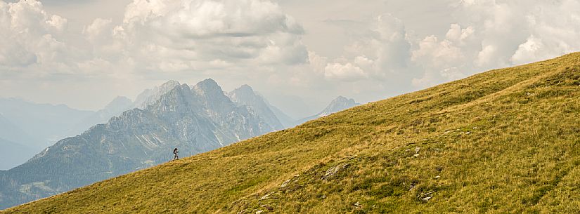 Trekking along the path to the panoramic peak of Monte Crostis, Panoramica delle Vette, Ravascletto, Carnia