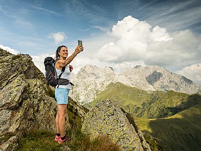 Trekking along the path to the panoramic peak of Monte Crostis, Panoramica delle Vette, Ravascletto, Carnia.