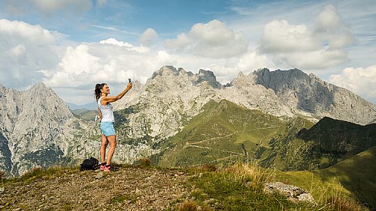 Trekking along the path to the panoramic peak of Monte Crostis, Panoramica delle Vette, Ravascletto, Carnia.