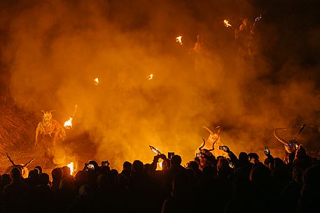 Krampus and St Nicholas, the tradition of 5 December in Tarvisio. Here in the historic village of Camporosso in Valcanale
