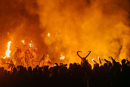 Krampus and St Nicholas, the tradition of 5 December in Tarvisio. Here in the historic village of Camporosso in Valcanale