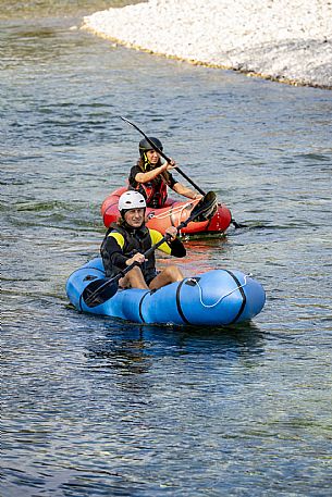 Canoeing, kayaking, and packraft activities on the river in the Pinzano al Tagliamento area, near the confluence of the Arzino and Tagliamanto rivers.