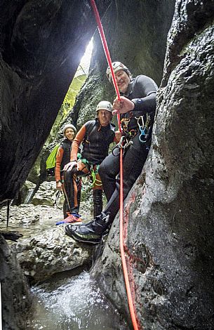 Canyoning in Rio Pielungo, Val d’Arzino Friuli Venezia Giulia, Italy. Participants navigate a spectacular canyon system carved into limestone and dolomite rock, progressing through narrow gorges, natural pools, waterfalls and rope descents under the supervision of the guide. The Rio Pielungo is considered one of the most scenic canyoning routes in the region, combining technical progression, geological interest and a uniquely wild atmosphere shaped by water and time.  [IT] Canyoning nel Rio Pielungo, Val d’Arzino (Friuli Venezia Giulia, Italia). I partecipanti attraversano uno spettacolare sistema di canyon scavato nelle rocce calcaree e dolomitiche, avanzando tra strette gole, pozze naturali, cascate e calate su corda sotto la supervisione di una Guida certificata. Il Rio Pielungo è considerato uno dei percorsi di canyoning più suggestivi della regione, grazie alla combinazione di progressione tecnica, interesse geologico e un’atmosfera autenticamente selvaggia modellata dall’acqua e dal tempo.